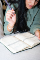 Open page of the Romanticize Your Life Journal featuring inspiring writing prompts.